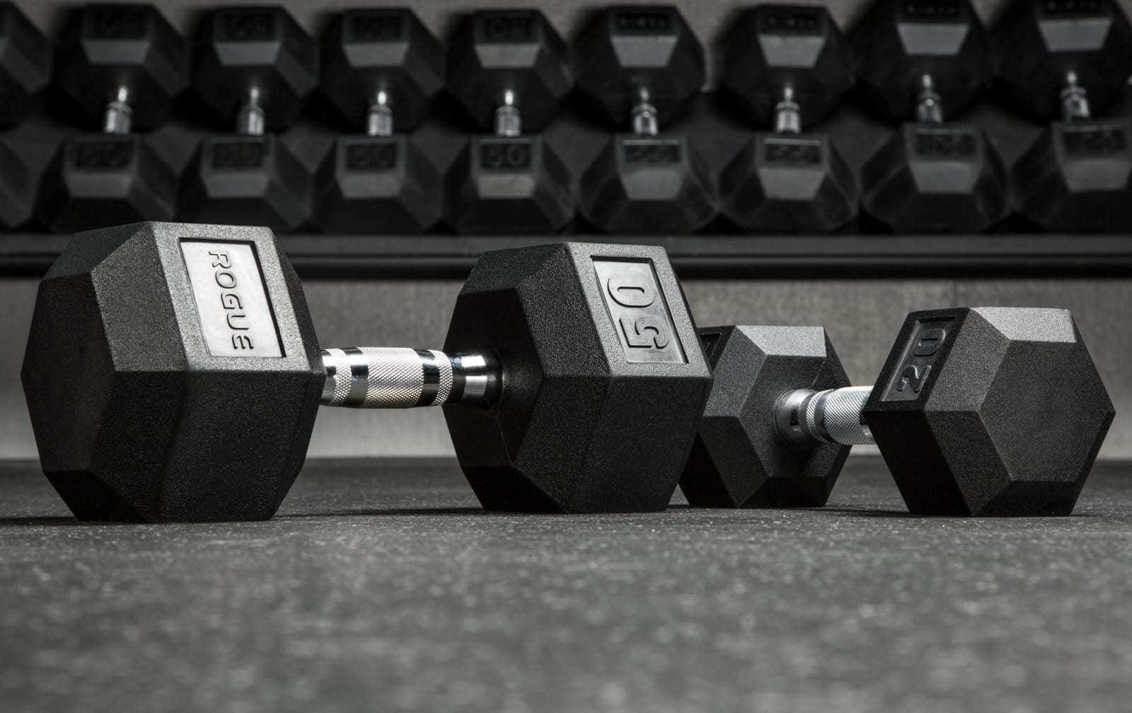 **Rogue Rubber Hex Dumbbells** are a premium fixed-weight option for 2025, built for durability and performance in both home and commercial gyms. Available in weights from 2.5 to 125 pounds, they feature a rubber-encased head to minimize noise and protect floors, paired with a knurled chrome handle for superior grip. The hexagonal shape prevents rolling, ensuring safety during workouts. While they’re not adjustable and require more storage space, their rugged construction
